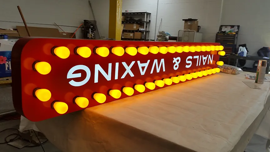 Illuminated parking sign cabinet